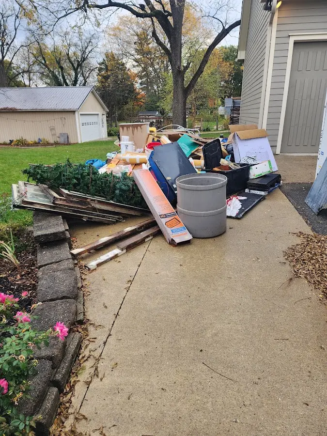 Dumpster being loaded with debris for 30 Yard Dumpster Rental in Streator